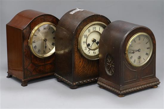 A French burr walnut mantel clock, a French oak mantel clock and an English oak mantel clock